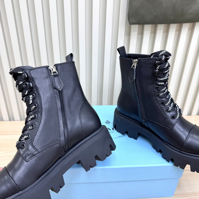 PRADA 25S MONOLITH BOOTS IN BLACK CALFSKIN