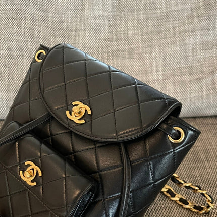 CHANEL 26S BACKPACK WITH FRONT POCKET 21 IN BLACK QUILTED LAMBSKIN GOLD HARDWARE