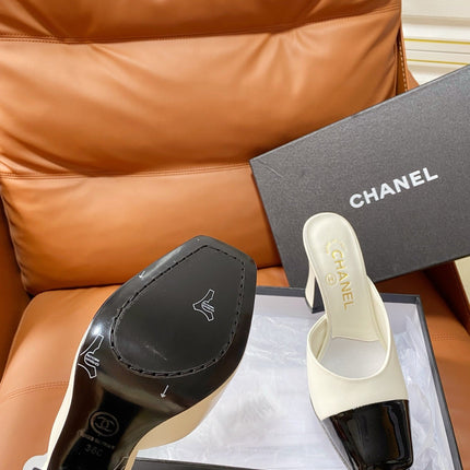 CHANEL 26S HIGH-HEEL MULES 90 MM IN BLACK AND WHITE LAMBSKIN
