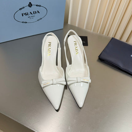PRADA 26S POINTED-TOE SLINGBACK PUMPS IN WHITE PATENT CALFSKIN WITH BOW