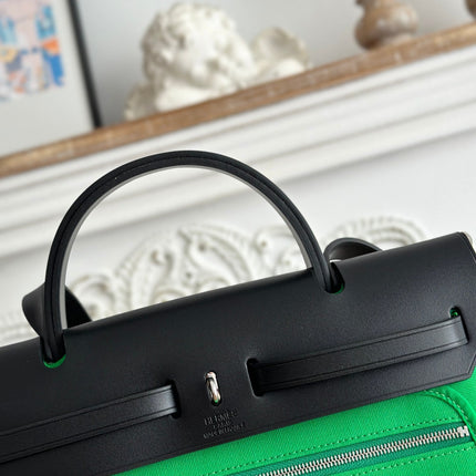 ZIP CABINE 31 BAG IN EMERALD GREEN CANVAS AND BLACK CALFSKIN