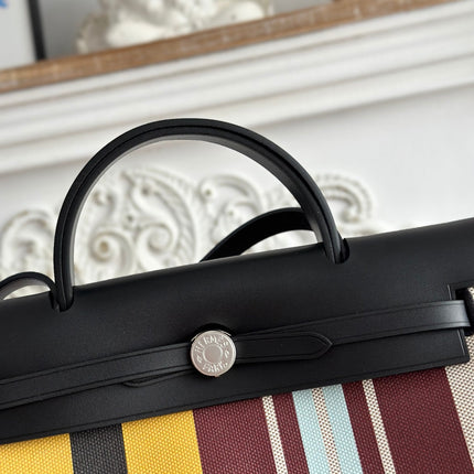 HERBAG ZIP 31 LAQUERED BAG IN BROWN MIX YELLOW H PLUME CANVAS