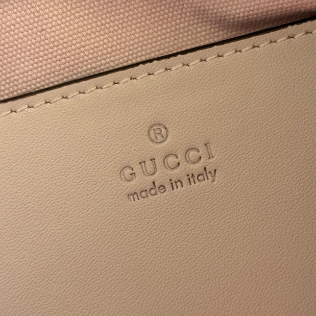 GUCCI 26S GG EMBLEM BUCKET BAG 22 IN LIGHT PINK COATED FABRIC