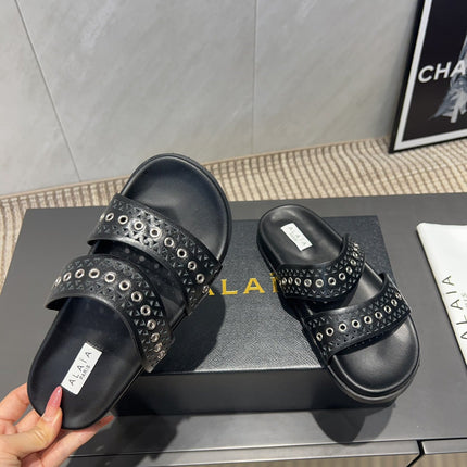 ALAIA DOUBLE-STRAP SANDALS 25S IN BLACK CALFSKIN