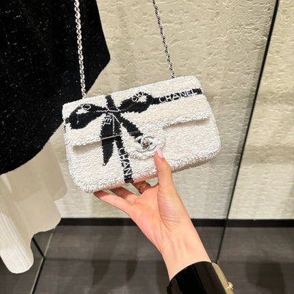 CHANEL 25S FLAP BAG 20 CM IN WHITE SEQUINS WITH BLACK BOW