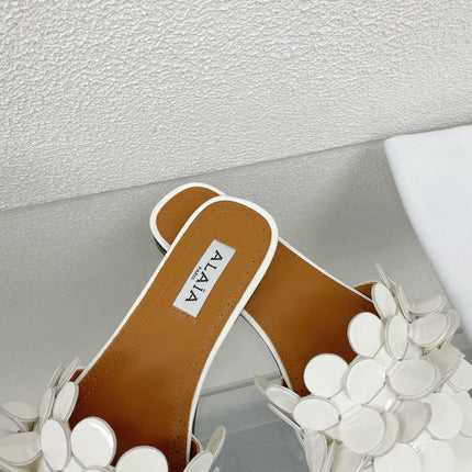 ALAIA FLAT MULE IN WHITE GLOSSY LAMBSKIN
