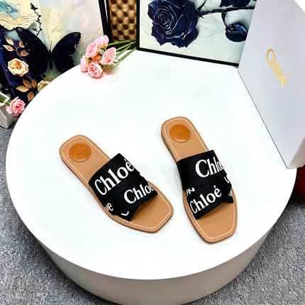 CHLOE 26S CRISSCROSS SLIDES IN BLACK CANVAS
