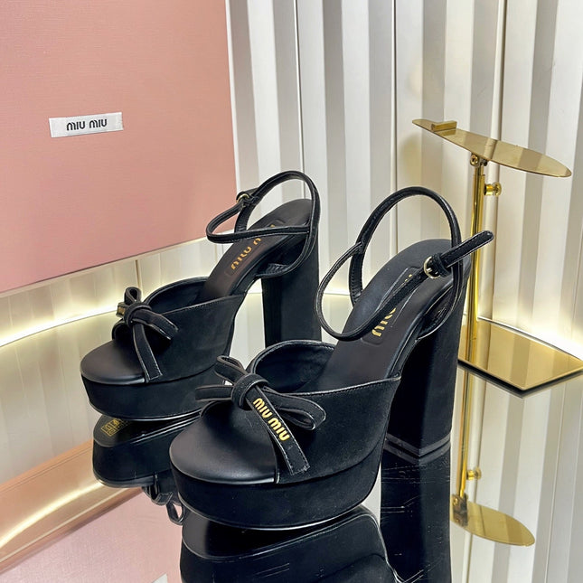 MIUMIU 26S PLATFORM ANKLE STRAP SANDALS 120MM IN BLACK SUEDE WITH BOW