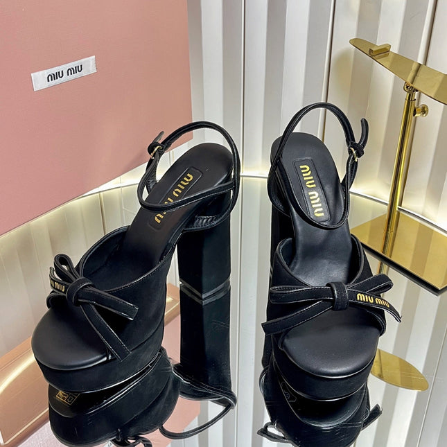 MIUMIU 26S PLATFORM ANKLE STRAP SANDALS 120MM IN BLACK SUEDE WITH BOW