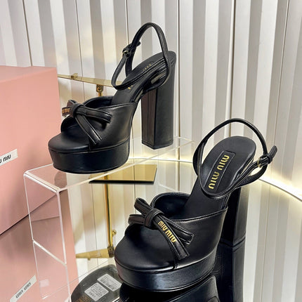 MIUMIU 26S PLATFORM ANKLE STRAP SANDALS 120MM IN BLACK CALFSKIN WITH BOW