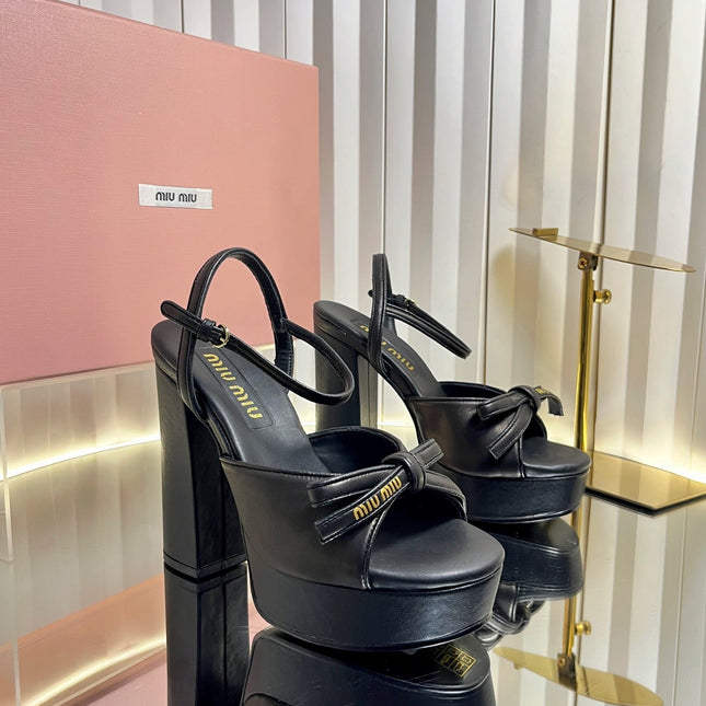MIUMIU 26S PLATFORM ANKLE STRAP SANDALS 120MM IN BLACK CALFSKIN WITH BOW