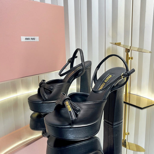 MIUMIU 26S PLATFORM ANKLE STRAP SANDALS 120MM IN BLACK CALFSKIN WITH BOW