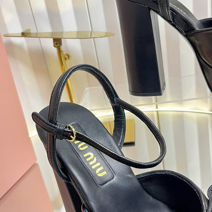 MIUMIU 26S PLATFORM ANKLE STRAP SANDALS 120MM IN BLACK CALFSKIN WITH BOW