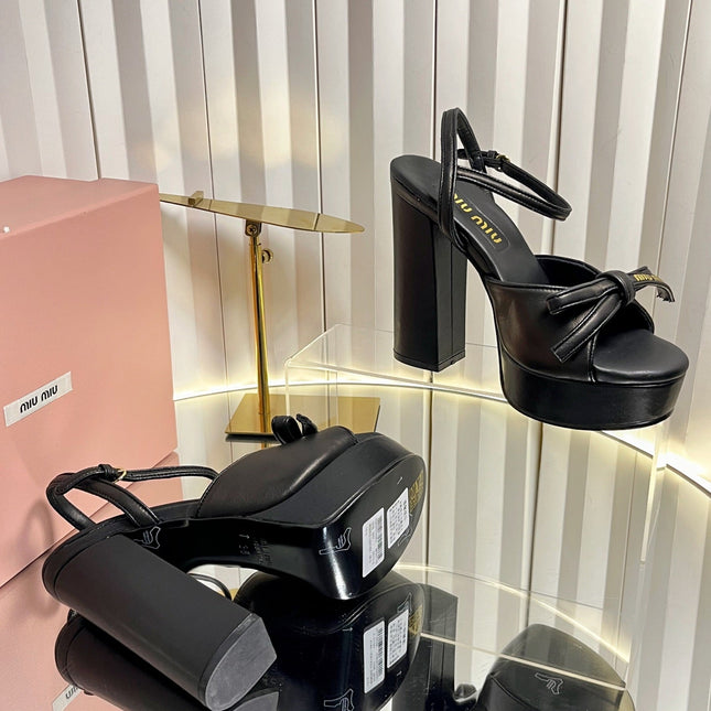 MIUMIU 26S PLATFORM ANKLE STRAP SANDALS 120MM IN BLACK CALFSKIN WITH BOW