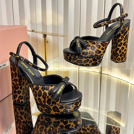 MIUMIU 26S PLATFORM ANKLE STRAP SANDALS 120MM IN LEOPARD PRINT CALF HAIR WITH BOW
