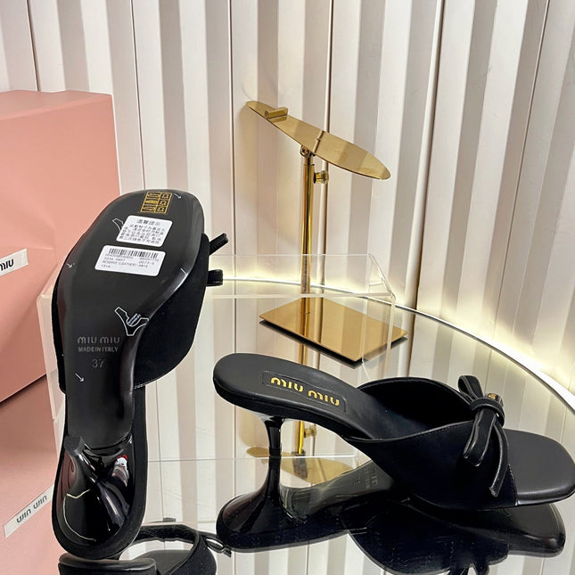 MIUMIU 26S MULE SANDALS 55MM IN BLACK SUEDE WITH BOW