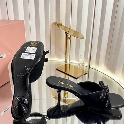 MIUMIU 26S MULE SANDALS 55MM IN BLACK SUEDE WITH BOW