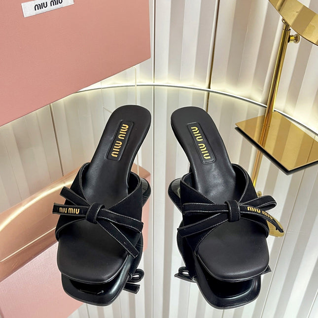MIUMIU 26S MULE SANDALS 55MM IN BLACK SUEDE WITH BOW