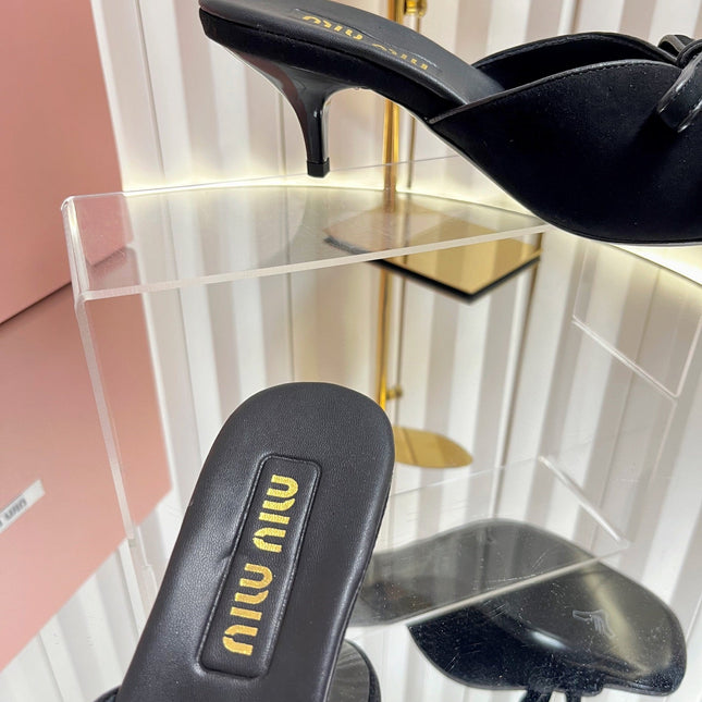 MIUMIU 26S MULE SANDALS 55MM IN BLACK SUEDE WITH BOW