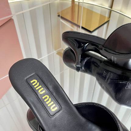 MIUMIU 26S MULE SANDALS 55MM IN BLACK CALFSKIN WITH BOW