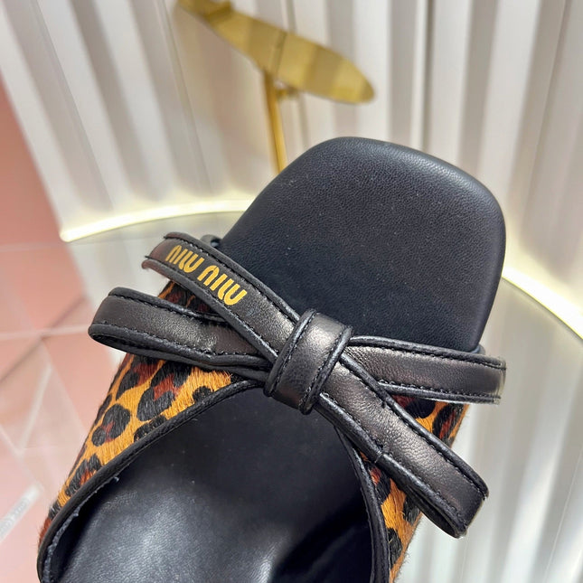 MIUMIU 26S MULE SANDALS 55MM IN LEOPARD PRINT CALF HAIR WITH BOW