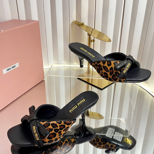 MIUMIU 26S MULE SANDALS 55MM IN LEOPARD PRINT CALF HAIR WITH BOW