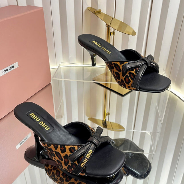 MIUMIU 26S MULE SANDALS 55MM IN LEOPARD PRINT CALF HAIR WITH BOW