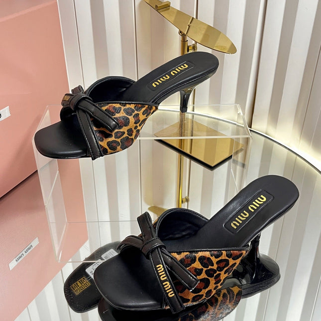 MIUMIU 26S MULE SANDALS 55MM IN LEOPARD PRINT CALF HAIR WITH BOW