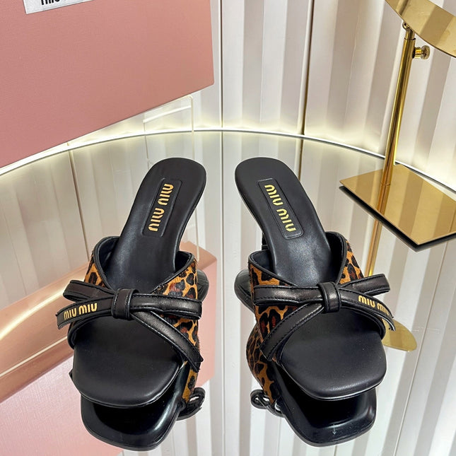 MIUMIU 26S MULE SANDALS 55MM IN LEOPARD PRINT CALF HAIR WITH BOW