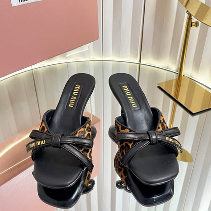 MIUMIU 26S MULE SANDALS 55MM IN LEOPARD PRINT CALF HAIR WITH BOW