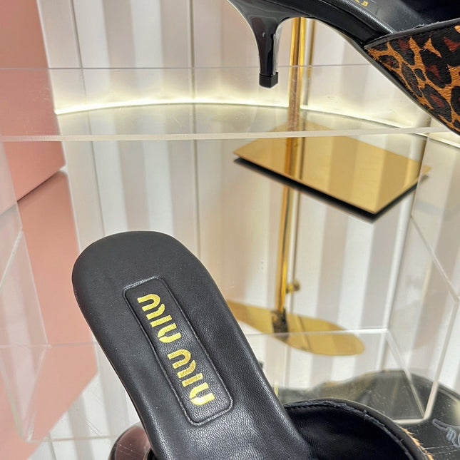 MIUMIU 26S MULE SANDALS 55MM IN LEOPARD PRINT CALF HAIR WITH BOW