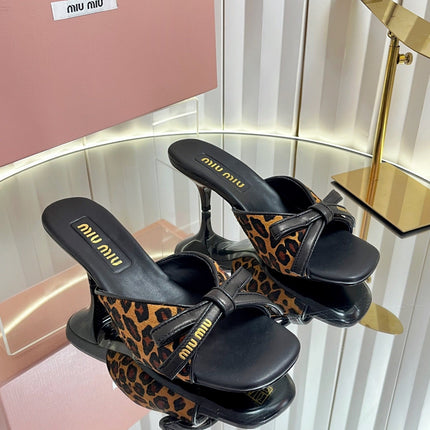 MIUMIU 26S MULE SANDALS 55MM IN LEOPARD PRINT CALF HAIR WITH BOW