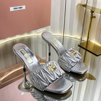 MIUMIU 26S HIGH-HEEL MULE SANDALS 85MM IN SILVER CALFSKIN GOLD HARDWARE