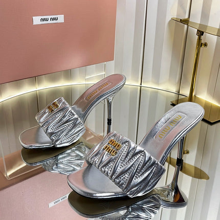 MIUMIU 26S HIGH-HEEL MULE SANDALS 85MM IN SILVER CALFSKIN GOLD HARDWARE