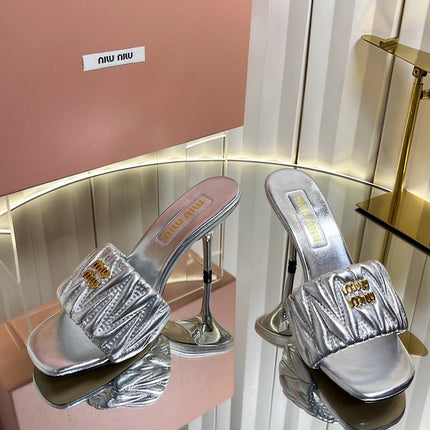 MIUMIU 26S HIGH-HEEL MULE SANDALS 85MM IN SILVER CALFSKIN GOLD HARDWARE