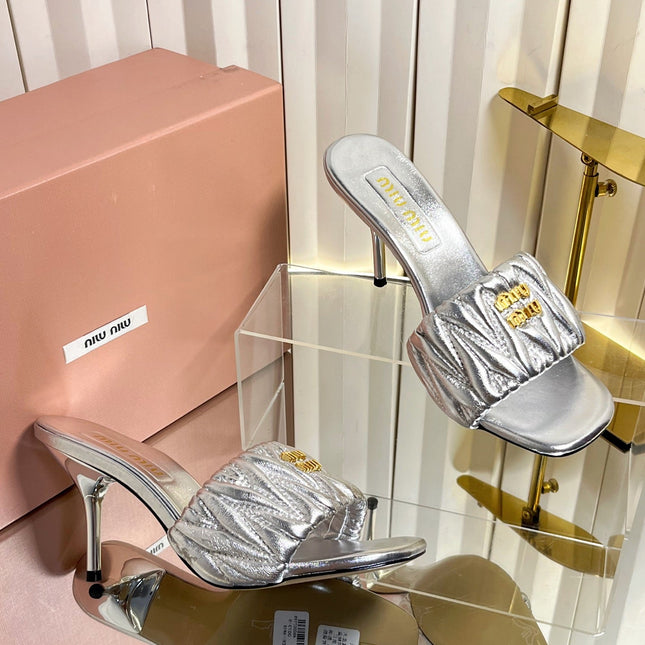 MIUMIU 26S HIGH-HEEL MULE SANDALS 85MM IN SILVER CALFSKIN GOLD HARDWARE