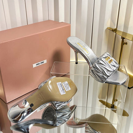 MIUMIU 26S HIGH-HEEL MULE SANDALS 85MM IN SILVER CALFSKIN GOLD HARDWARE