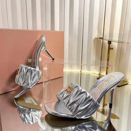 MIUMIU 26S HIGH-HEEL MULE SANDALS 85MM IN SILVER CALFSKIN GOLD HARDWARE