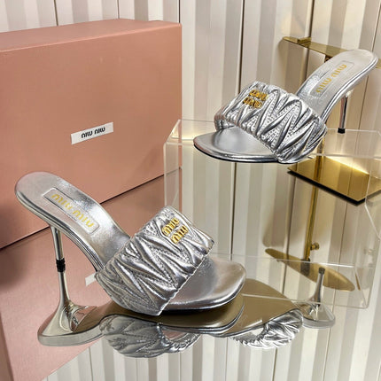 MIUMIU 26S HIGH-HEEL MULE SANDALS 85MM IN SILVER CALFSKIN GOLD HARDWARE