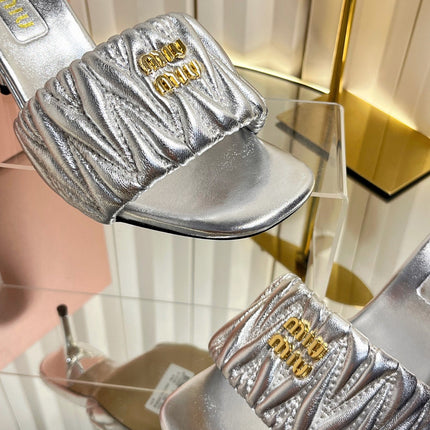 MIUMIU 26S HIGH-HEEL MULE SANDALS 85MM IN SILVER CALFSKIN GOLD HARDWARE