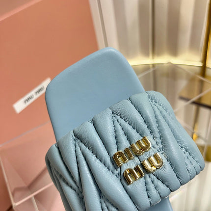 MIUMIU 26S PADDED MATELASSE MULE HEELS 65MM IN LIGHT BLUE CALFSKIN GOLD HARDWARE