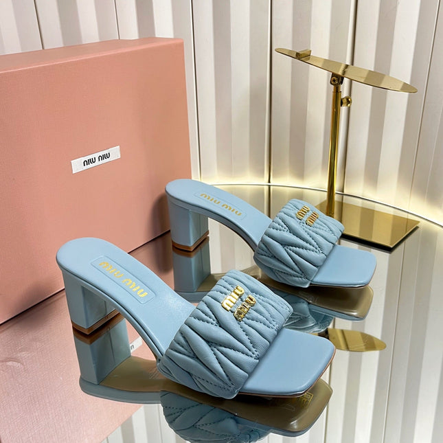MIUMIU 26S PADDED MATELASSE MULE HEELS 65MM IN LIGHT BLUE CALFSKIN GOLD HARDWARE