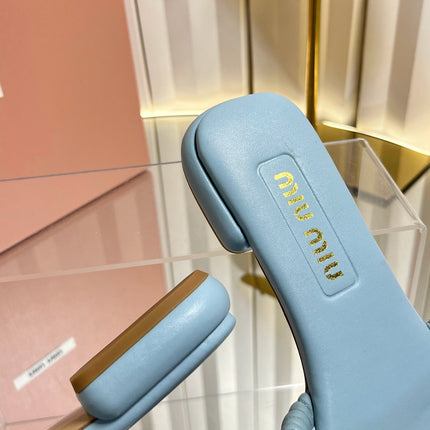 MIUMIU 26S MATELASSE SLIDES IN LIGHT BLUE CALFSKIN GOLD HARDWARE