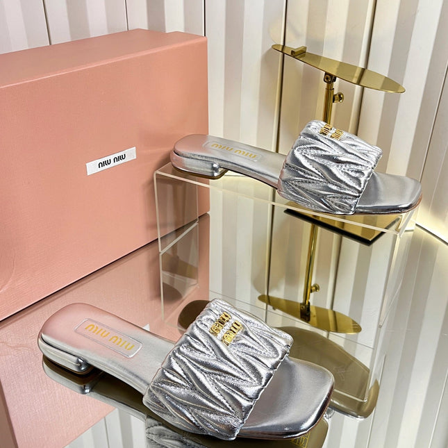 MIUMIU 26S MATELASSE SLIDES IN SILVER CALFSKIN GOLD HARDWARE