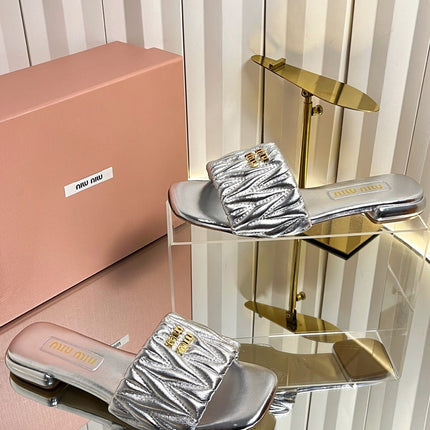 MIUMIU 26S MATELASSE SLIDES IN SILVER CALFSKIN GOLD HARDWARE