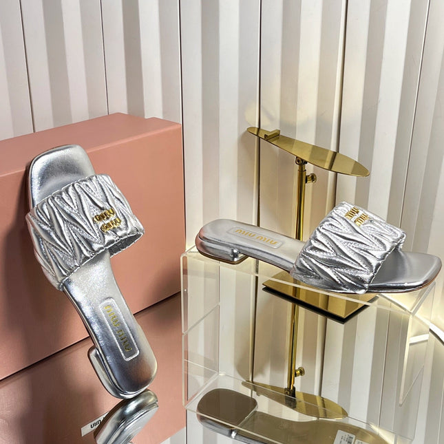 MIUMIU 26S MATELASSE SLIDES IN SILVER CALFSKIN GOLD HARDWARE