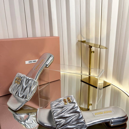 MIUMIU 26S MATELASSE SLIDES IN SILVER CALFSKIN GOLD HARDWARE