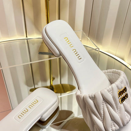 MIUMIU 26S MATELASSE SLIDES IN IVORY WHITE CALFSKIN GOLD HARDWARE