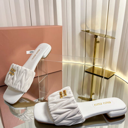 MIUMIU 26S MATELASSE SLIDES IN IVORY WHITE CALFSKIN GOLD HARDWARE