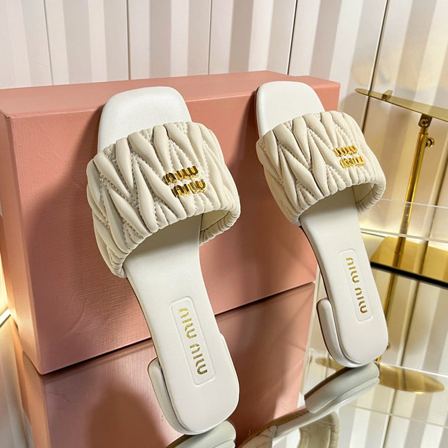 MIUMIU 26S MATELASSE SLIDES IN LIGHT BEIGE CALFSKIN GOLD HARDWARE